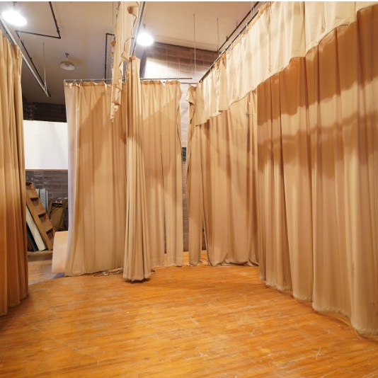 Earlier photograph of the theater stage and curtains